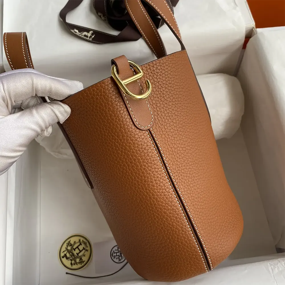 Side angle showing rich brown Clemence leather texture on Hermes Women In the Loop 18 Handbag