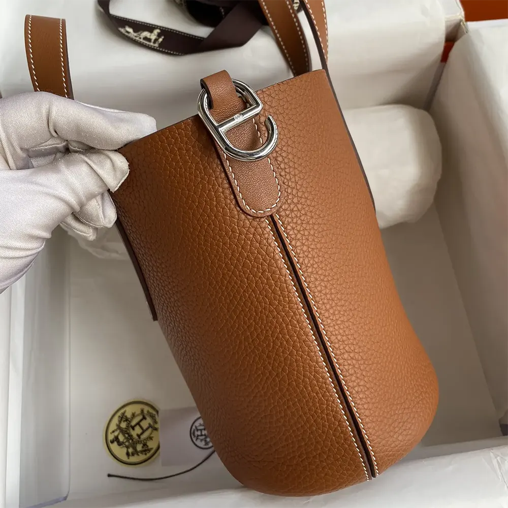 Side angle showing supple Clemence leather texture on Hermes Women In the Loop 18 Handbag