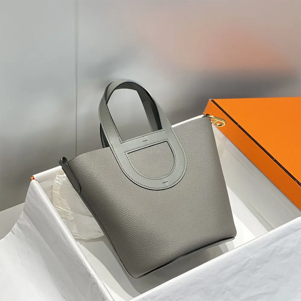 Side profile showing slim silhouette of Hermes Women In the Loop handbag