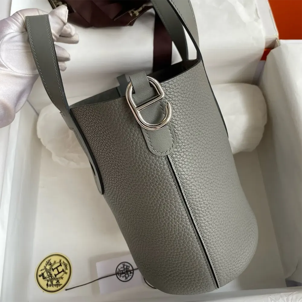Side profile showing supple Clemence leather texture on Hermes Women In the Loop