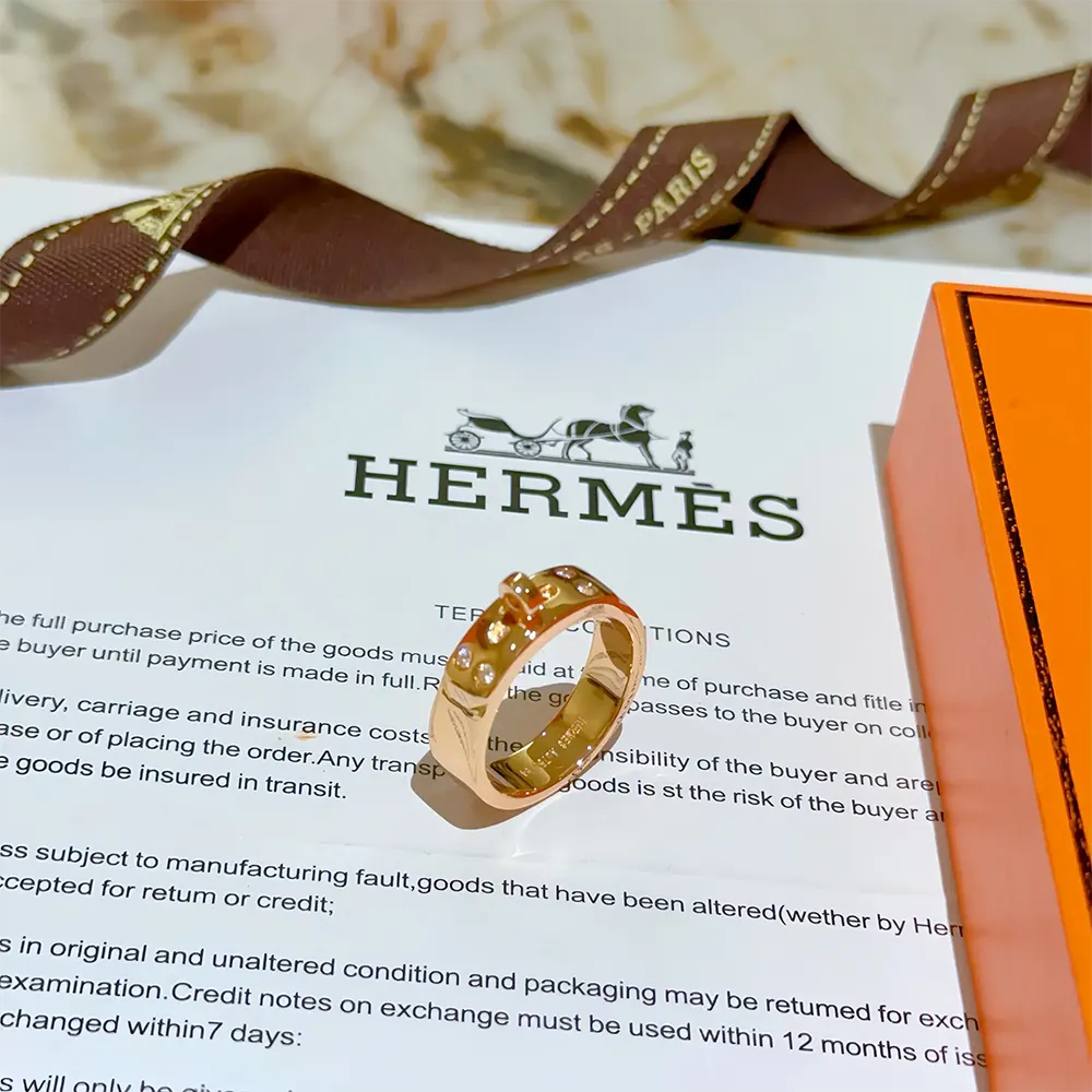 Side view of Hermes Women Kelly Ring Small Model gleaming gold finish