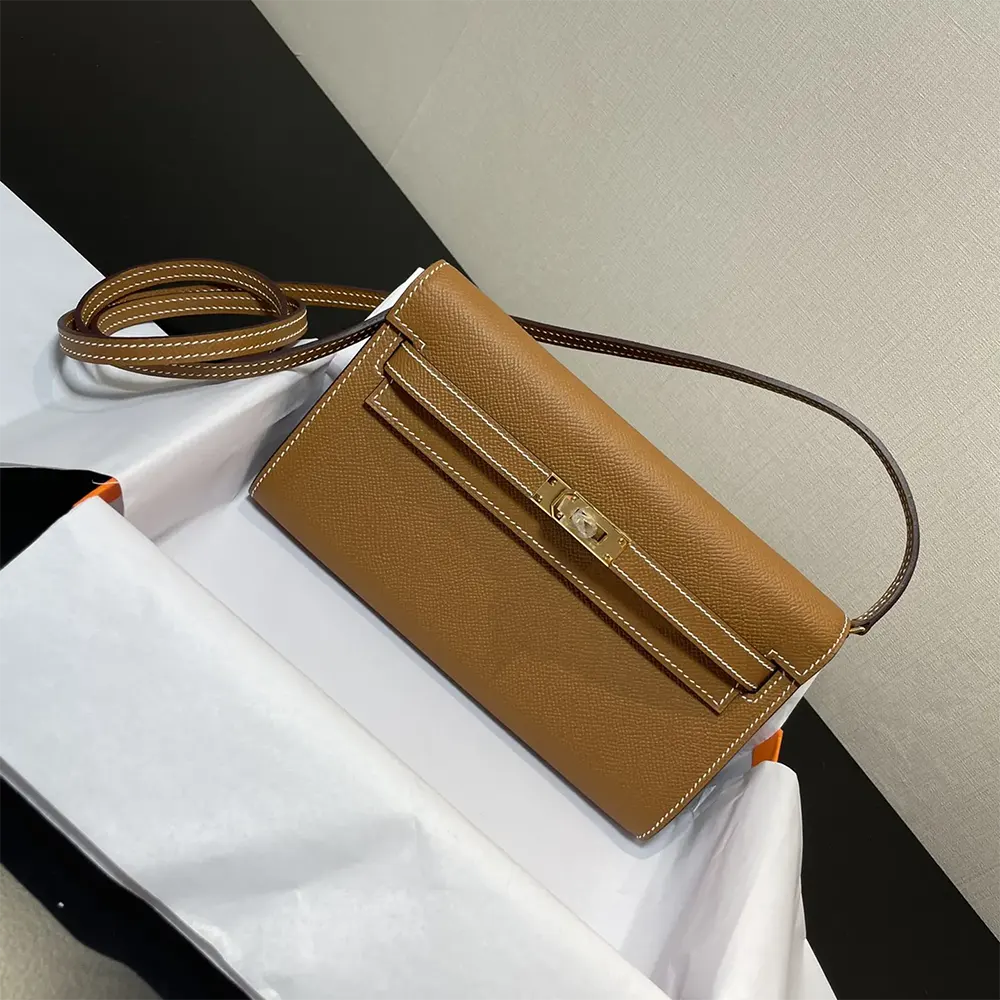 Close-up of gold hardware on Hermes Women Kelly To Go bag