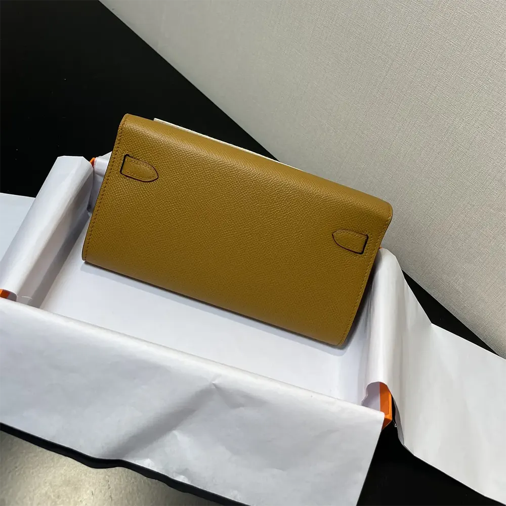Side angle showing compact silhouette of Hermes Women Kelly To Go bag