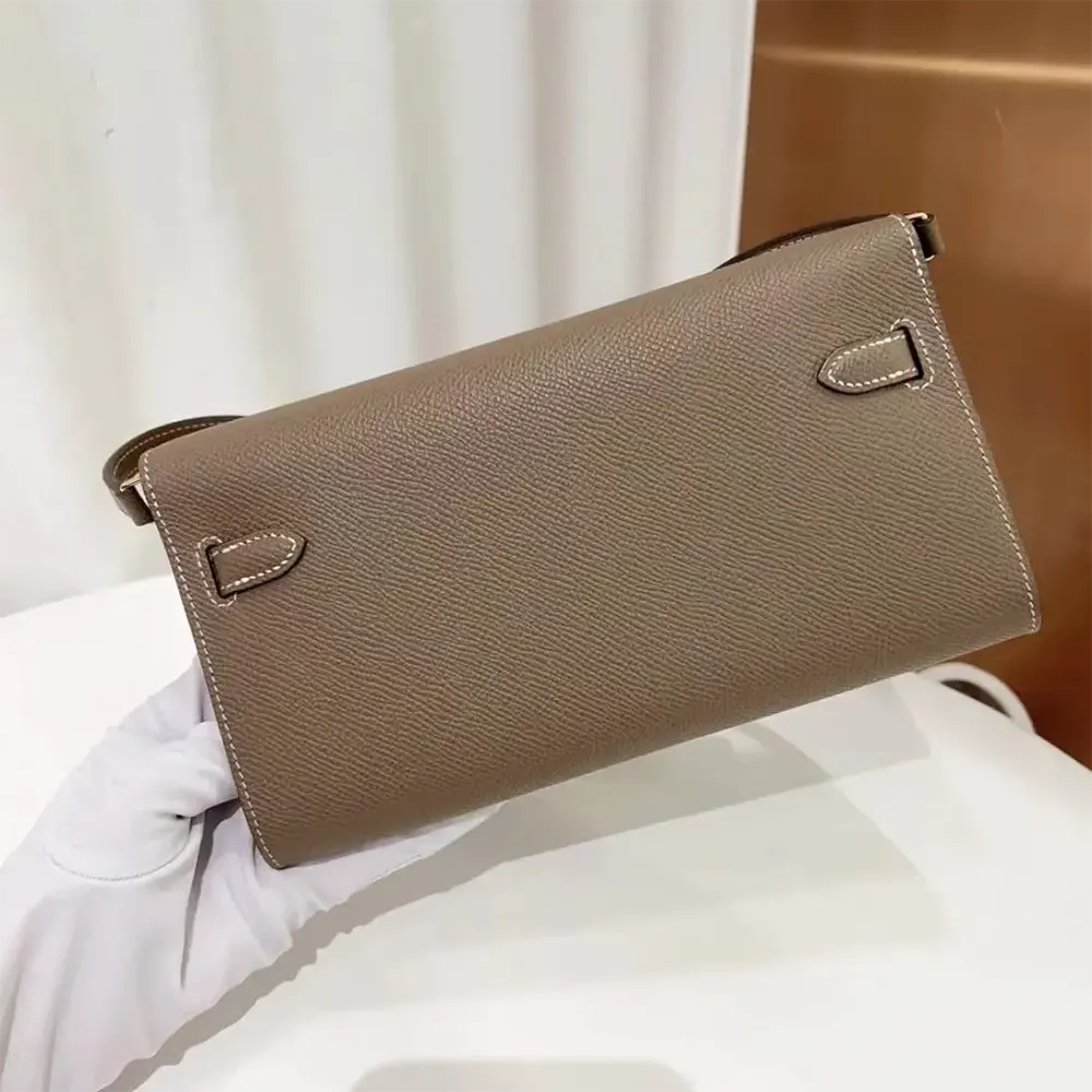 Side profile showing compact silhouette of Hermes Women Kelly To Go