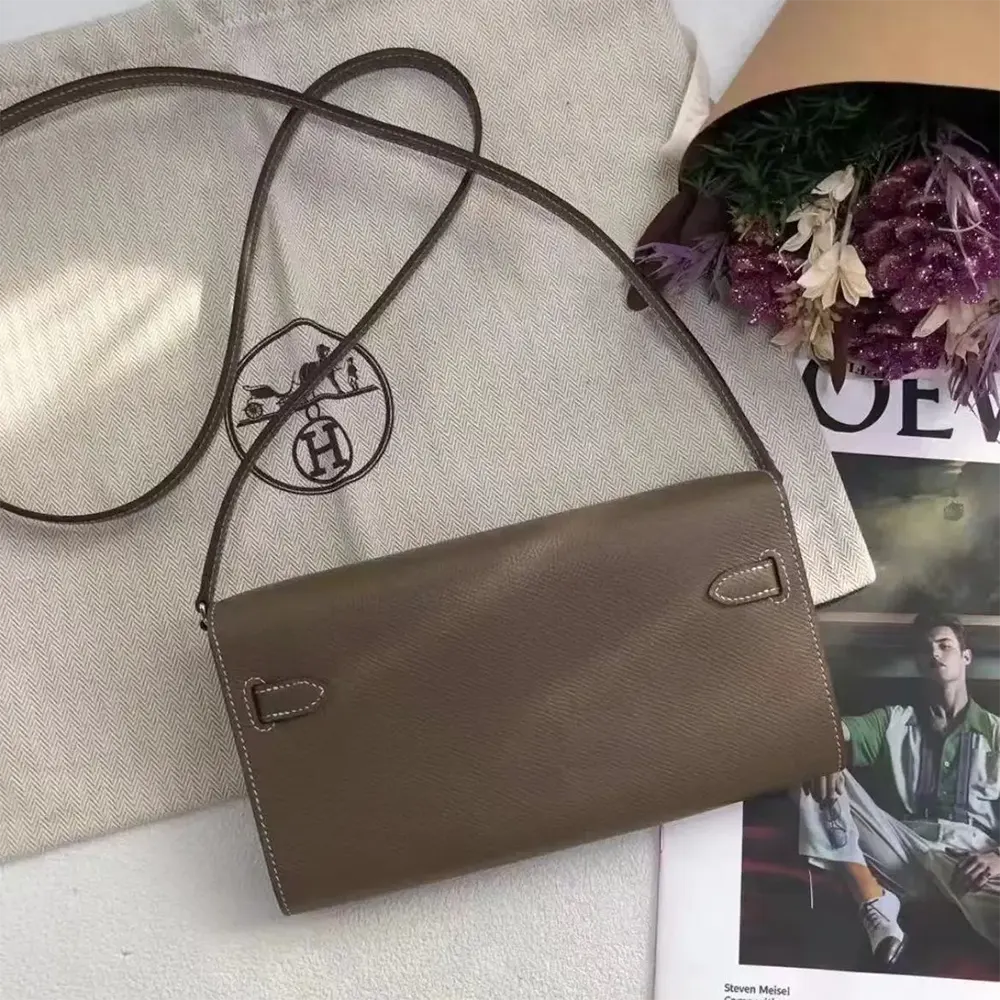 Side angle showing slim profile of Hermes Women Kelly To Go bag