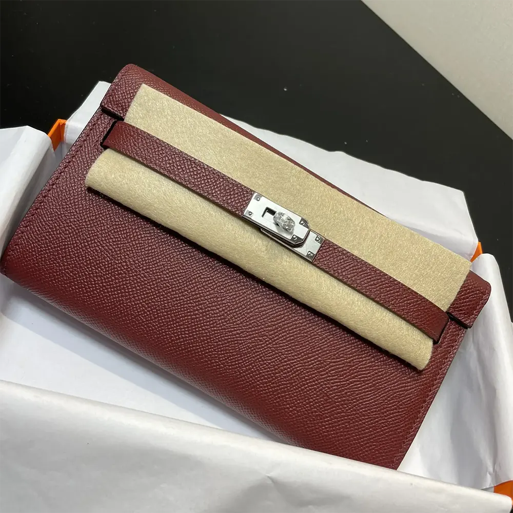 Close-up on silver-tone lock detail of Hermes Women Kelly To Go bag