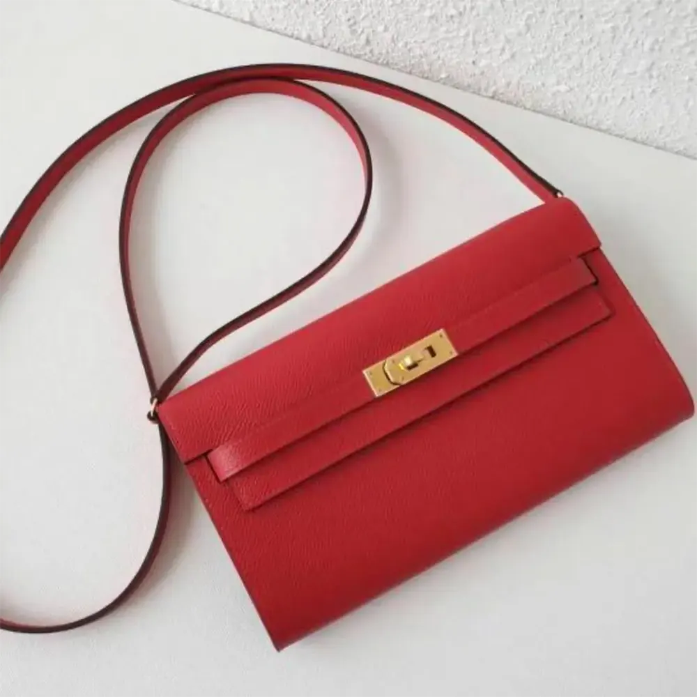 Close-up of silver hardware and clasp on Kelly To Go red bag