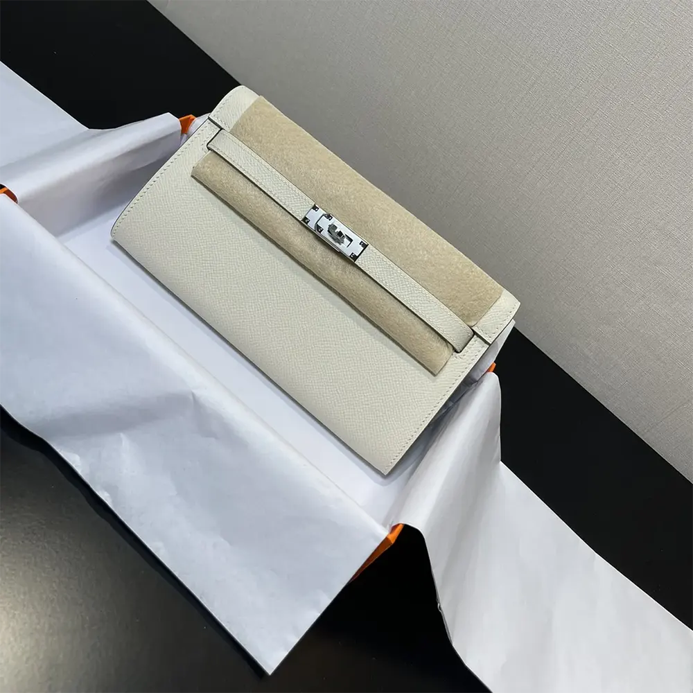 Close-up of silver turn-lock and hardware on Hermes Women Kelly To Go bag