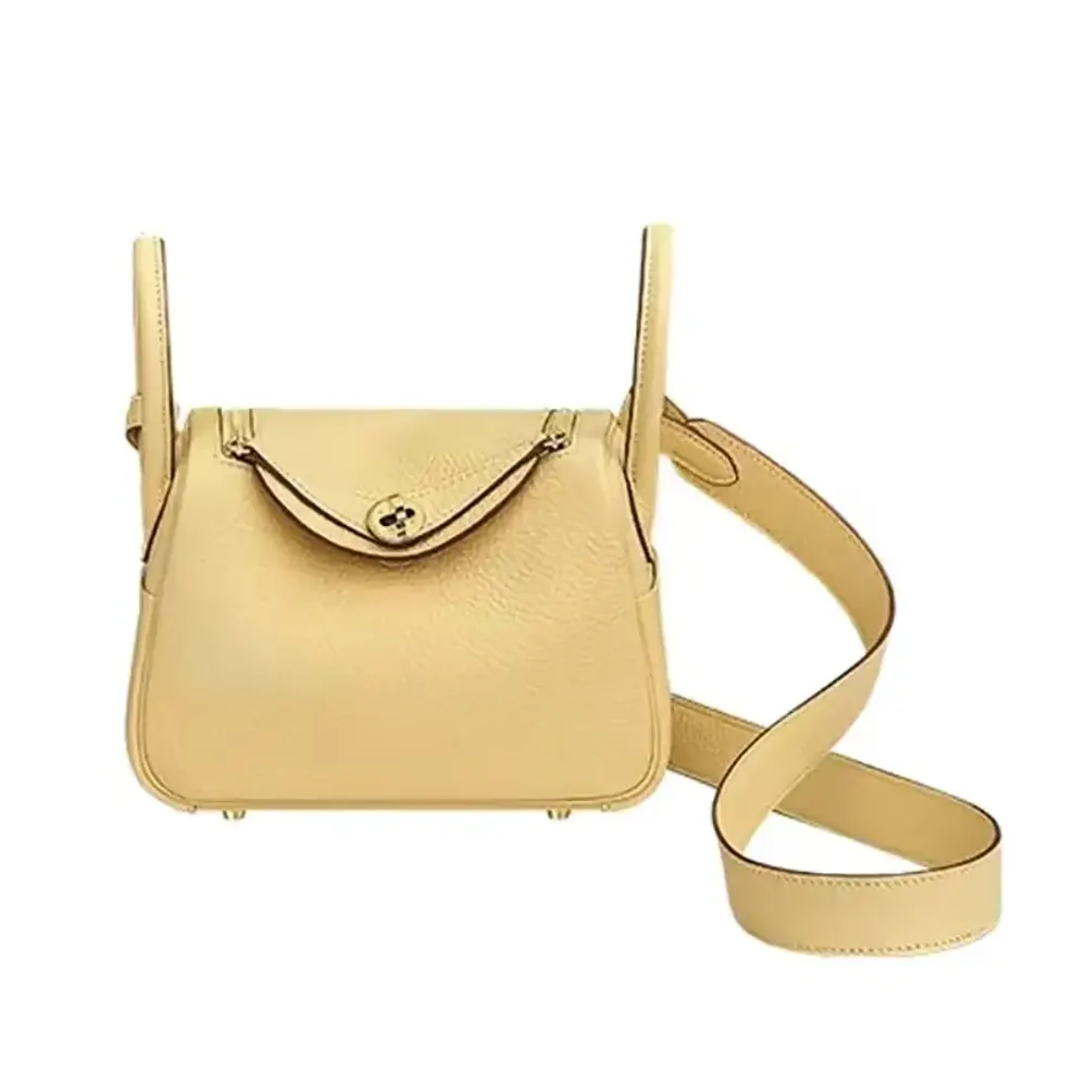 Front view of Hermes Women Lindy Mini 19 yellow leather bag