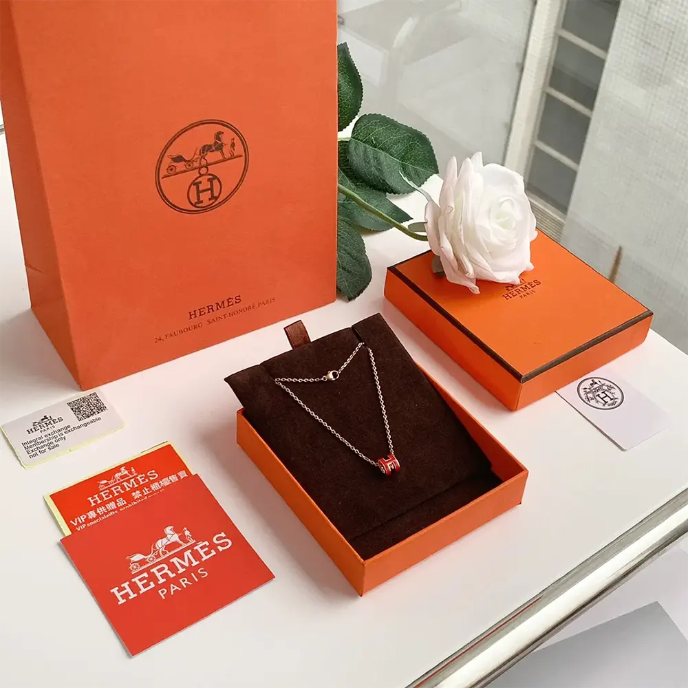 Side angle of Hermes Women Mini Pop H Pendant-Red highlighting silver closure