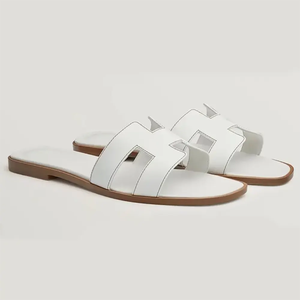 Side view of Hermes Women Oran Sandal-White showing H-cutout detail