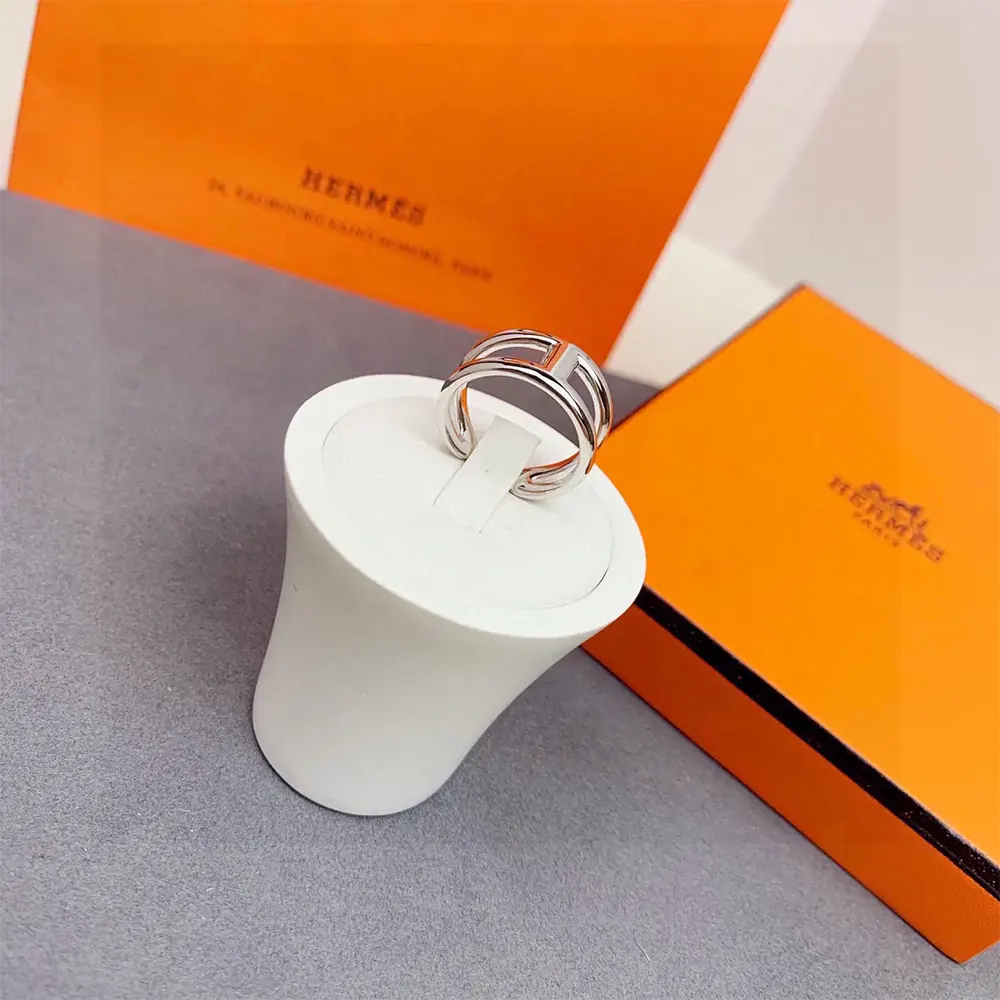 Detail of signature Hermes H motif on silver Osmose Ring