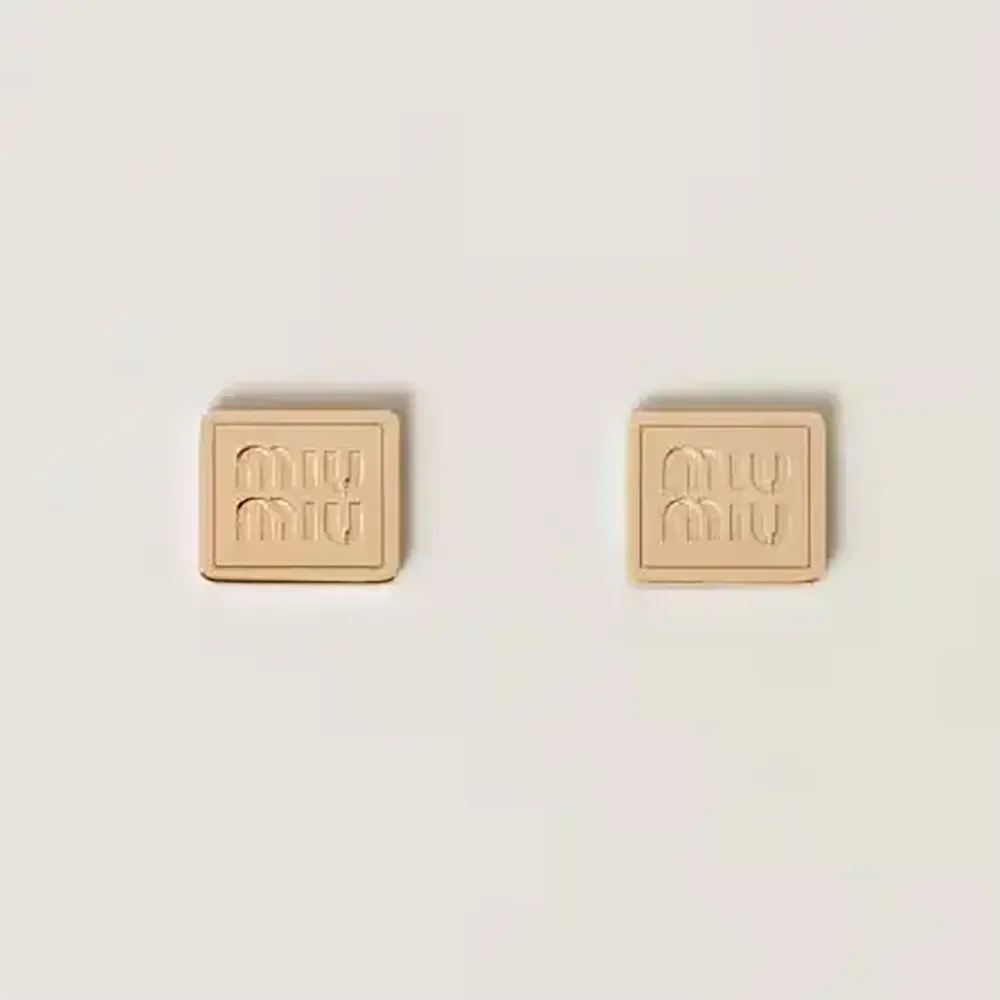 Front view of Miu Miu Women Metal Earrings with Visible Perforated Logo in gold