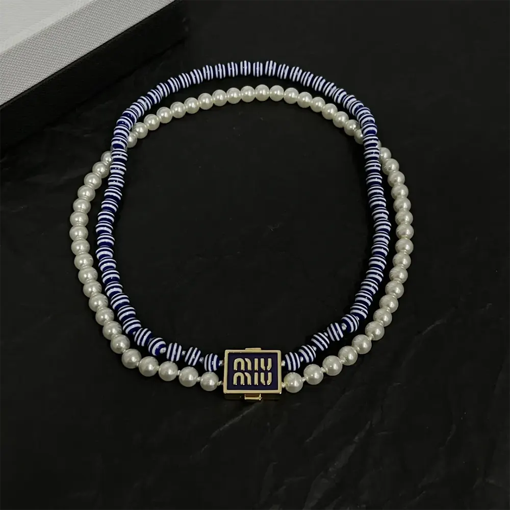 Side angle showing clasp and silhouette of Miu Miu Women Metal and Synthetic Pearl Choker