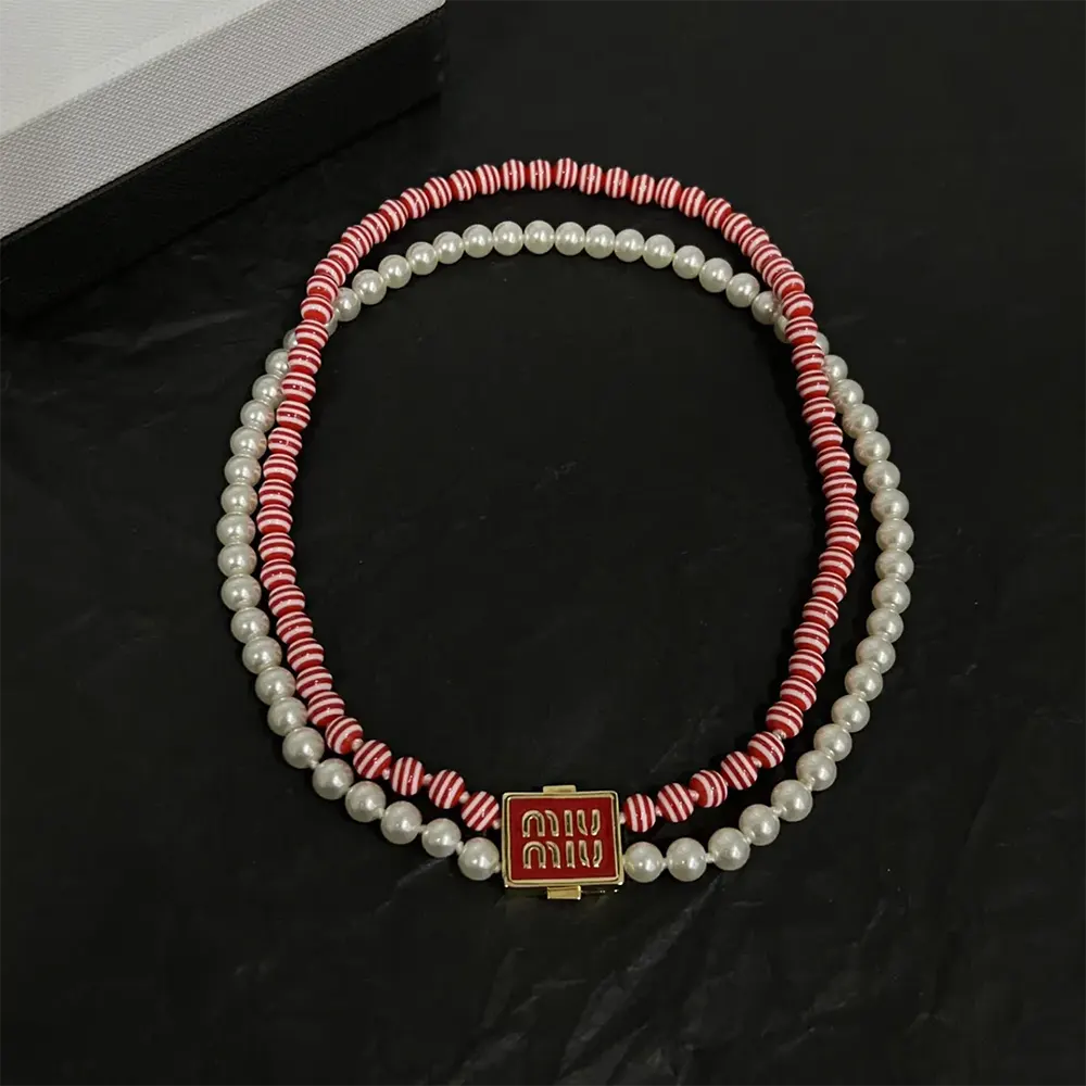 Side angle showing clasp and texture of Miu Miu Women Metal and Synthetic Pearl Choker