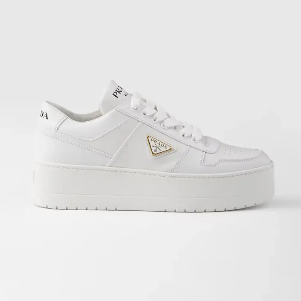 Side view of Prada Women Downtown Bold Leather Sneakers in white