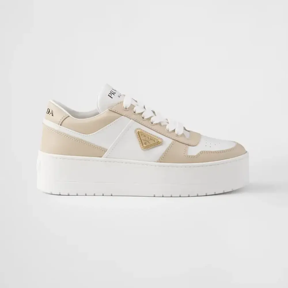 Side view of Prada Women Downtown Bold Leather Sneakers in beige