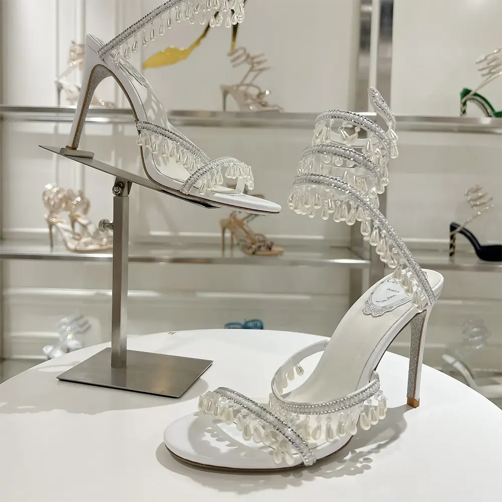 Close-up of chandelier crystal embellishments on Rene Caovilla Women Chandelier Ivory Sandal 105