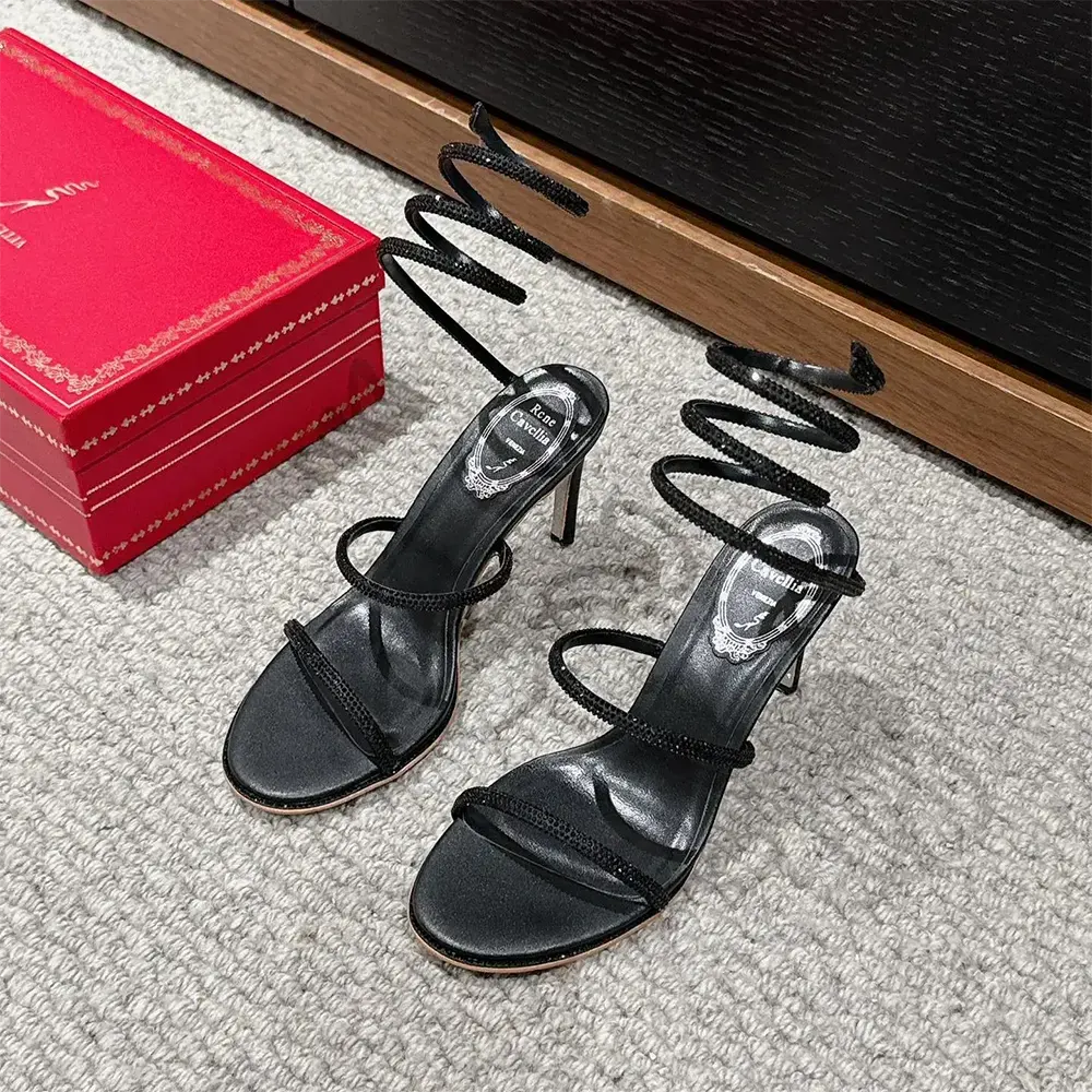 Close-up of crystal signature detail on Rene Caovilla Women Cleo Black Sandal 80