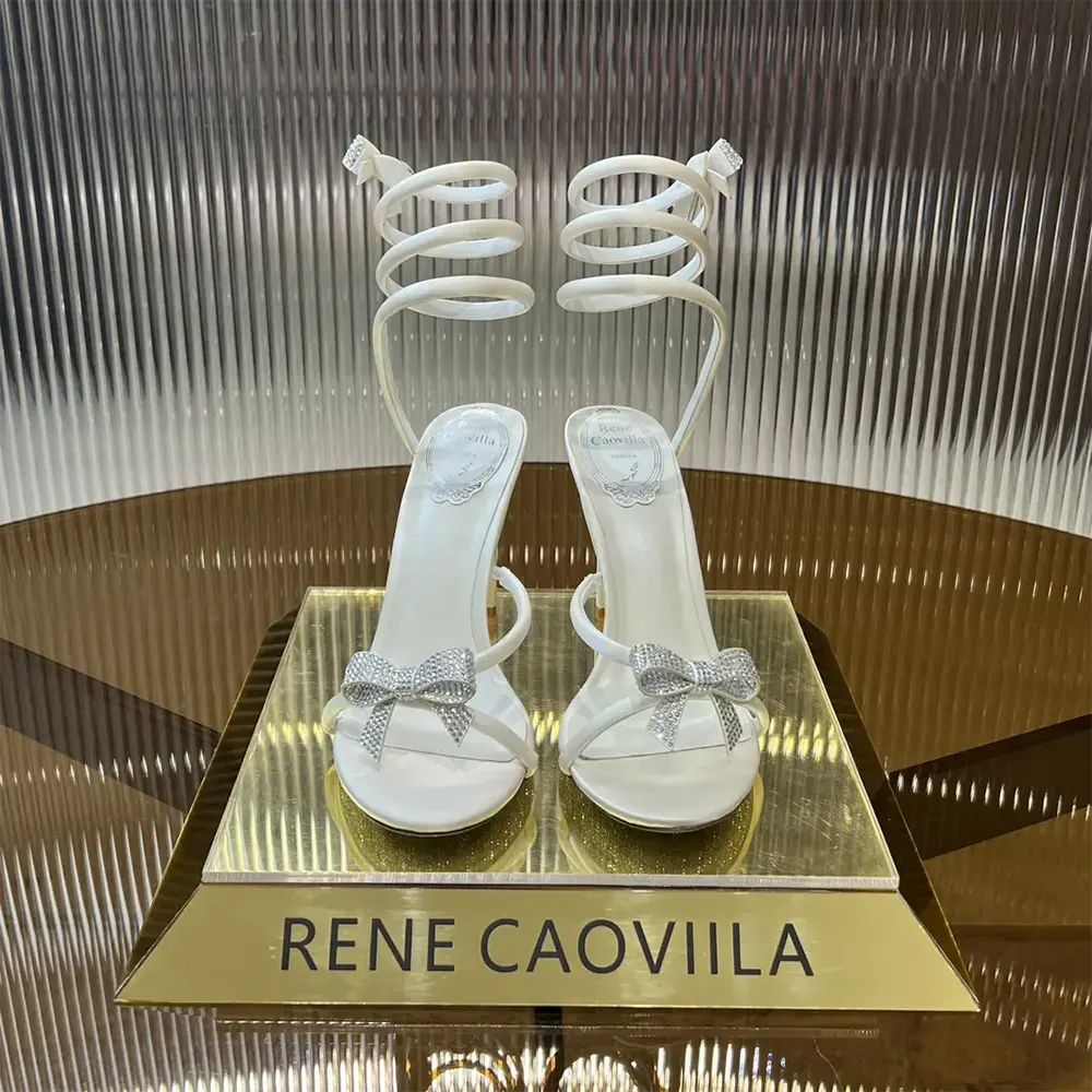 Close-up of crystal bow detail on Rene Caovilla Women Cleo Ivory Sandal
