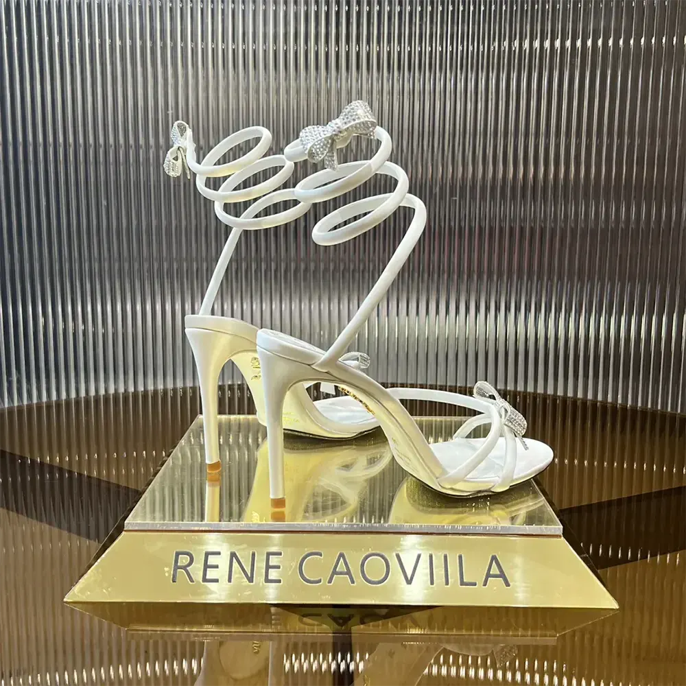 Back angle showing ankle strap on Rene Caovilla Women Cleo Ivory Sandal