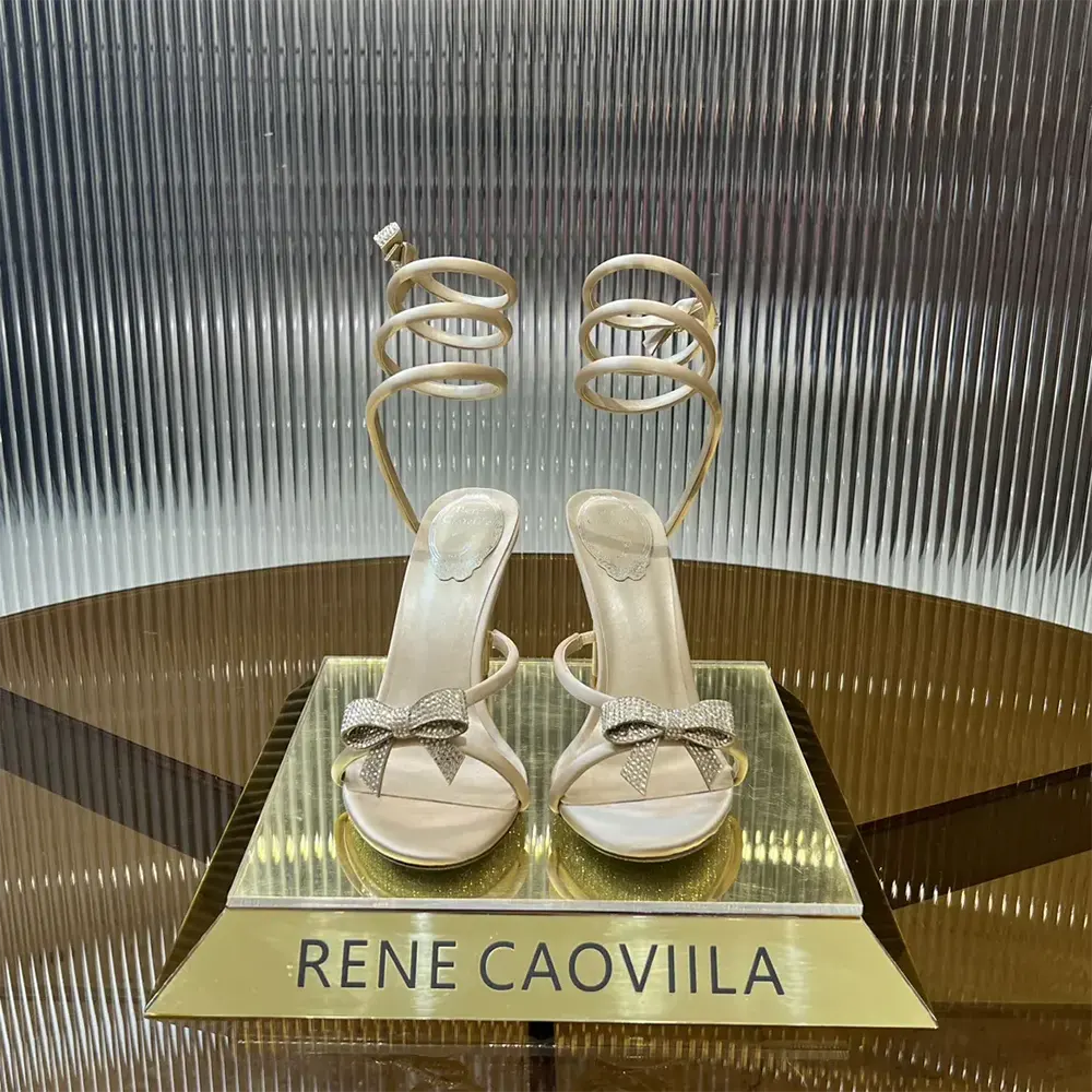 Close-up of bow detail on Rene Caovilla Women Cleo Nude Sandal