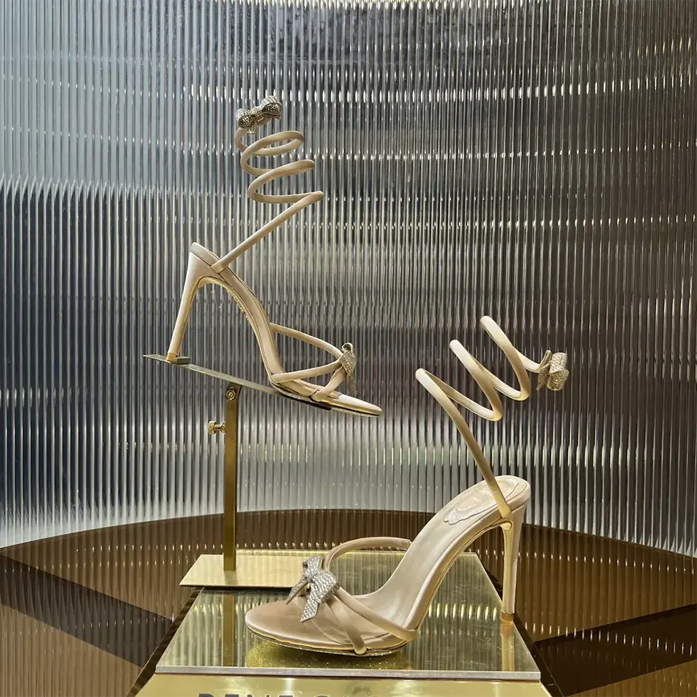 Side profile showcasing heel height of Rene Caovilla Women Cleo Nude Sandal