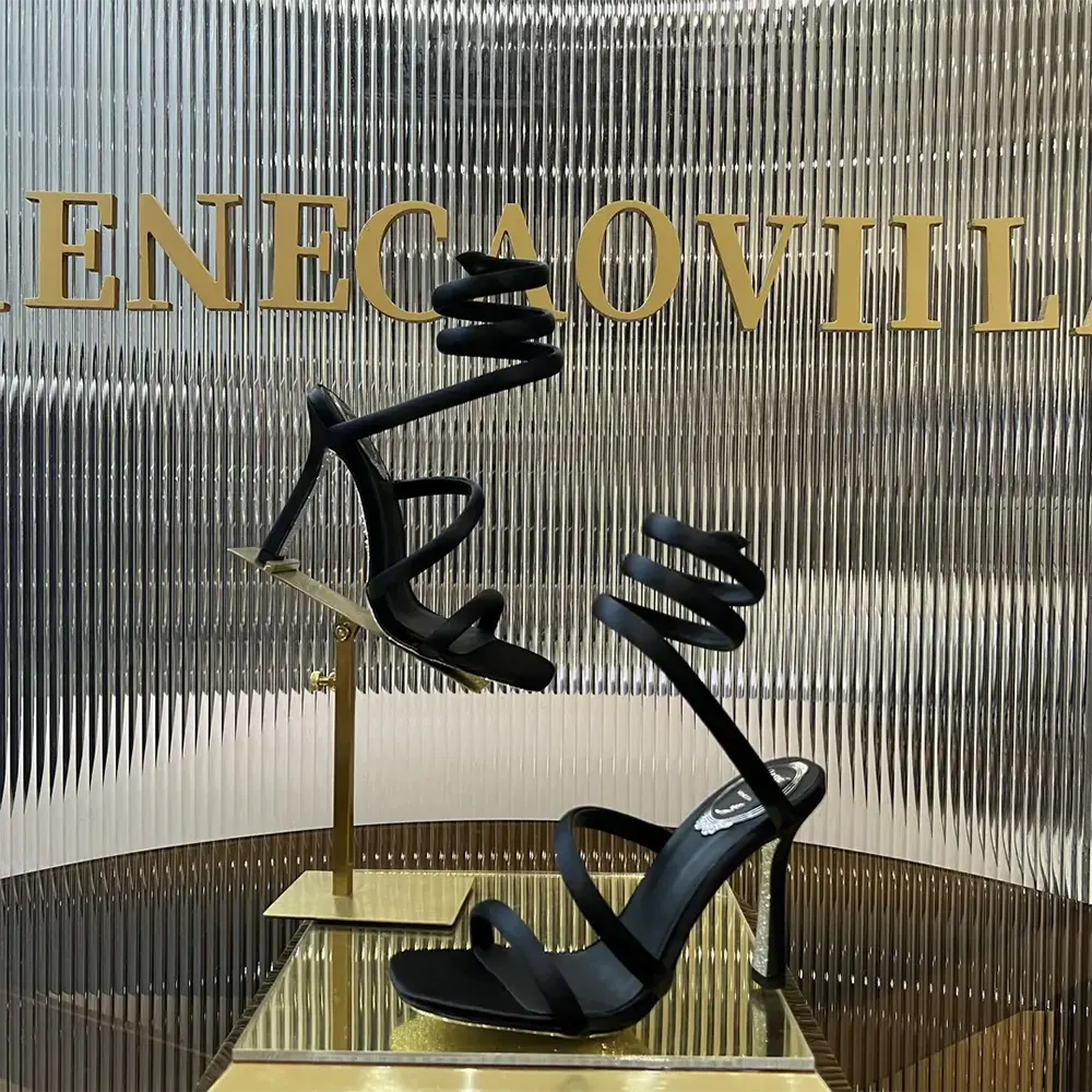 Close-up of crystal detailing on Rene Caovilla Cleopatra satin sandal