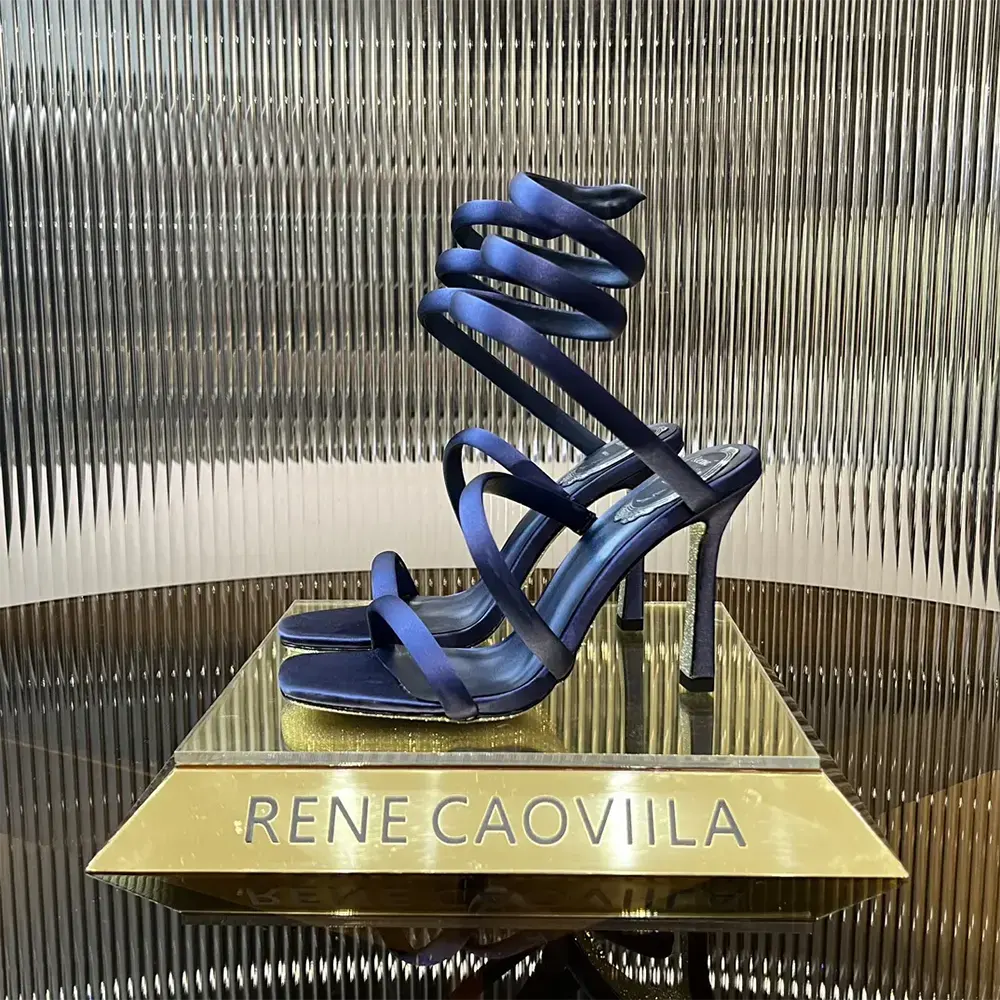 Top view showing navy satin and sleek stiletto heel of Rene Caovilla sandal