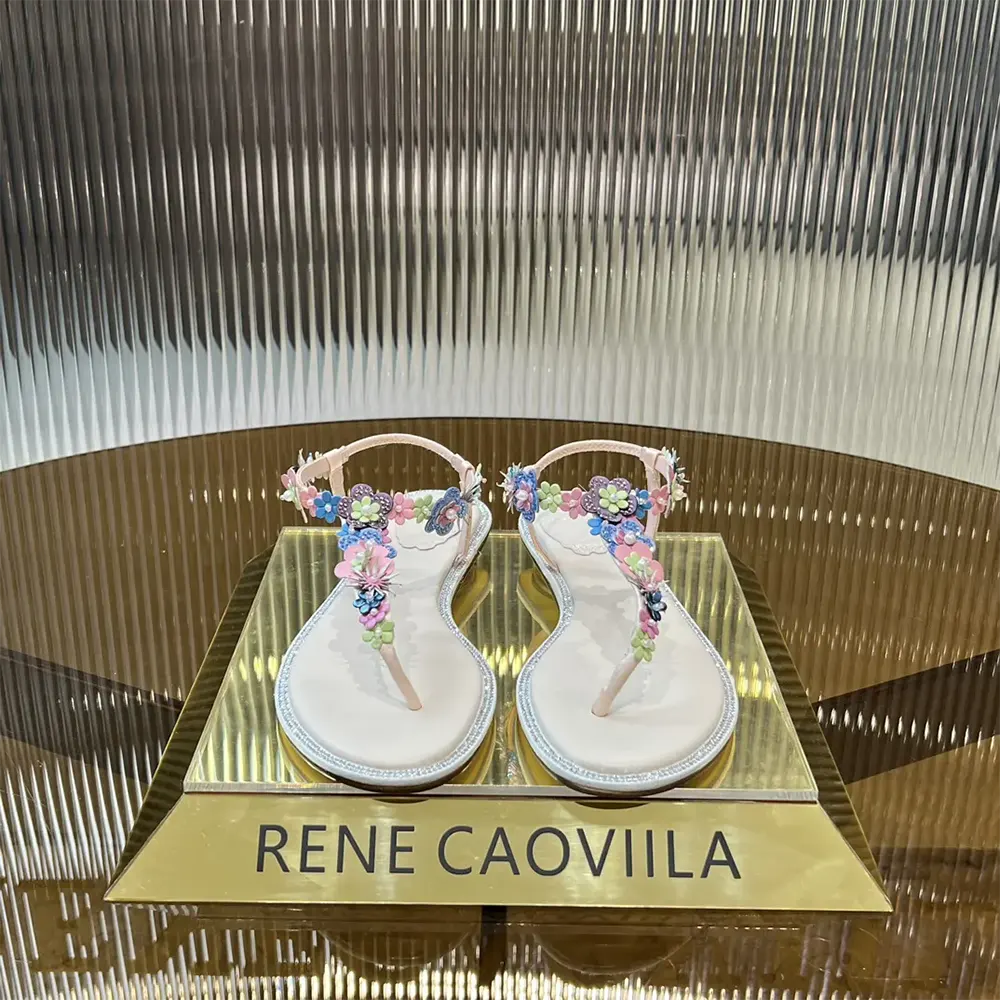 Close-up of crystal embellishments on Rene Caovilla Women Eden Nude Thong Sandal 10 strap
