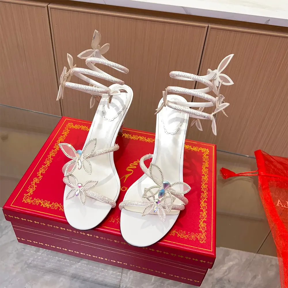 Close-up of crystal butterfly embellishments on Rene Caovilla Margot sandal