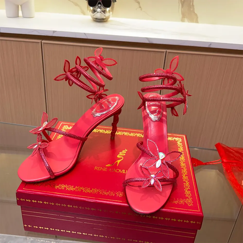 Top view showing red satin and gold buckle of Margot Red Powder sandal