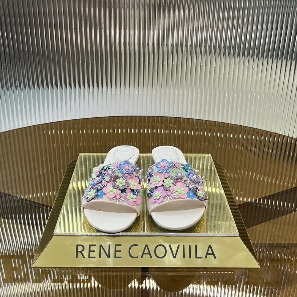 Close-up of crystal embellishments on Rene Caovilla Women Roxanne Nude Slider Sandal 10