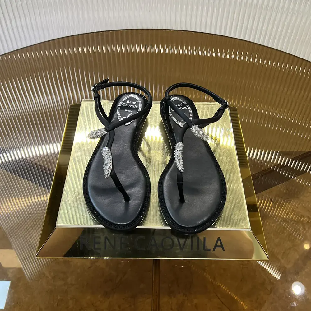 Top view of Rene Caovilla Women Serpente Black Thong Sandal 10 in size 10
