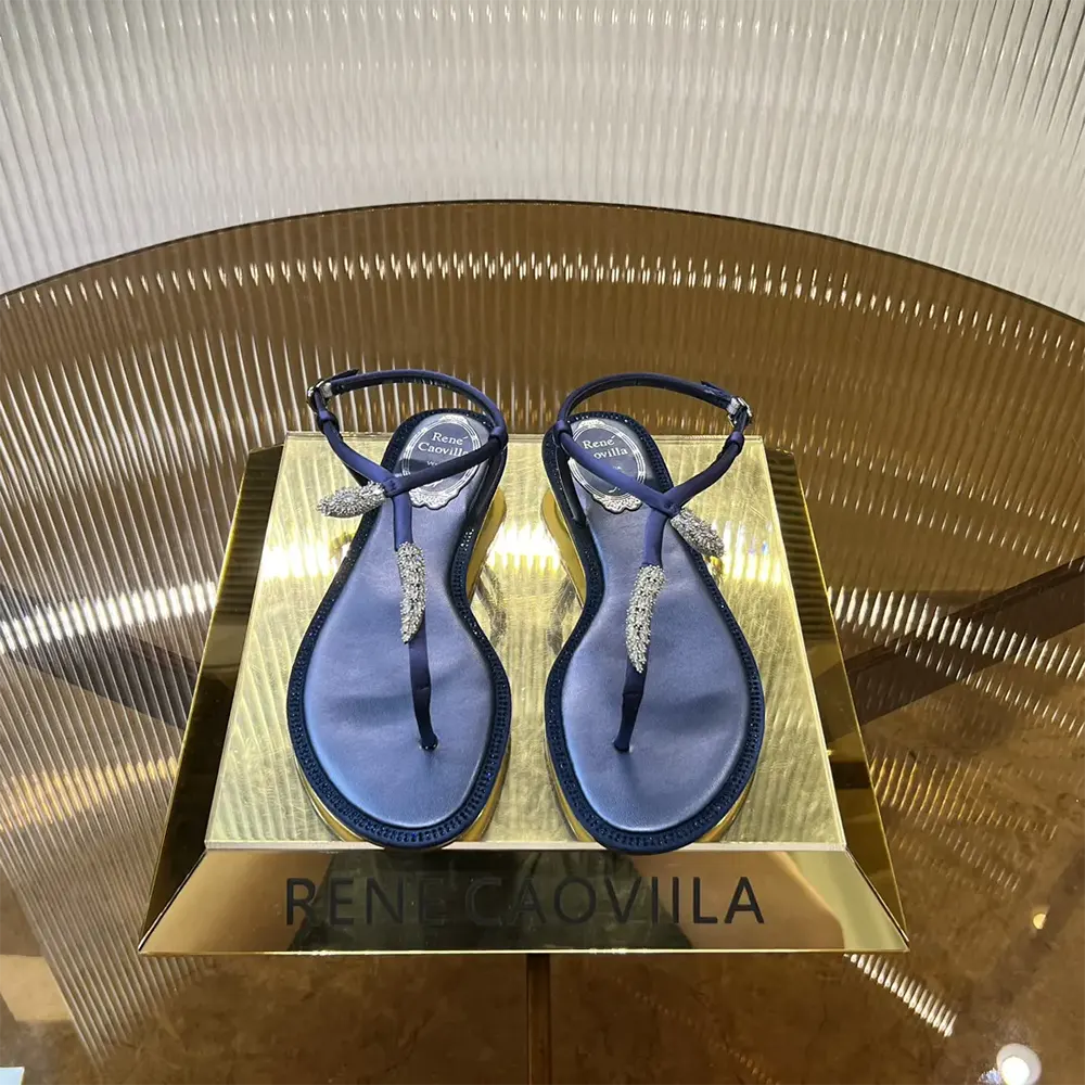 Close-up of crystal serpent detail on Rene Caovilla Women Serpente Indigo Thong Sandal 10