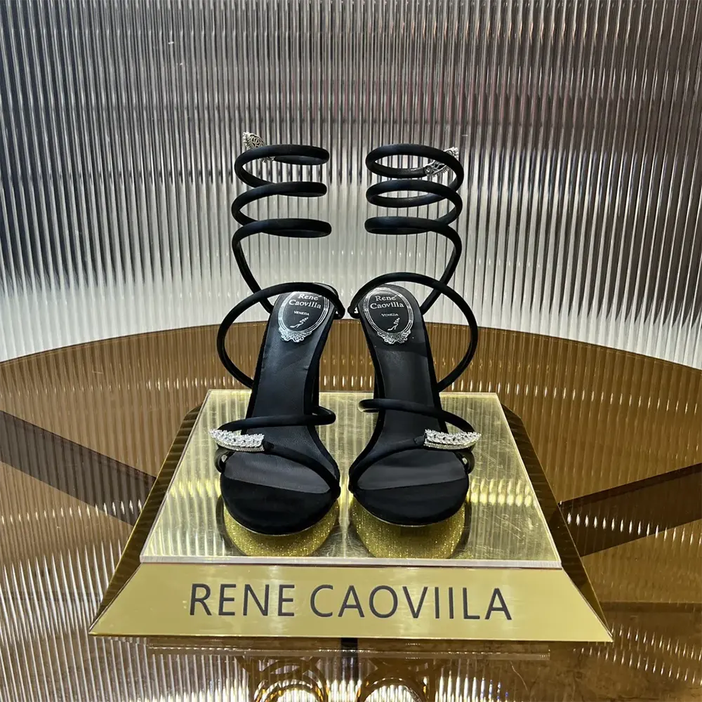 Close-up of crystal detailing on Rene Caovilla Women Serpente Midnight Black Sandal with Crystals 105
