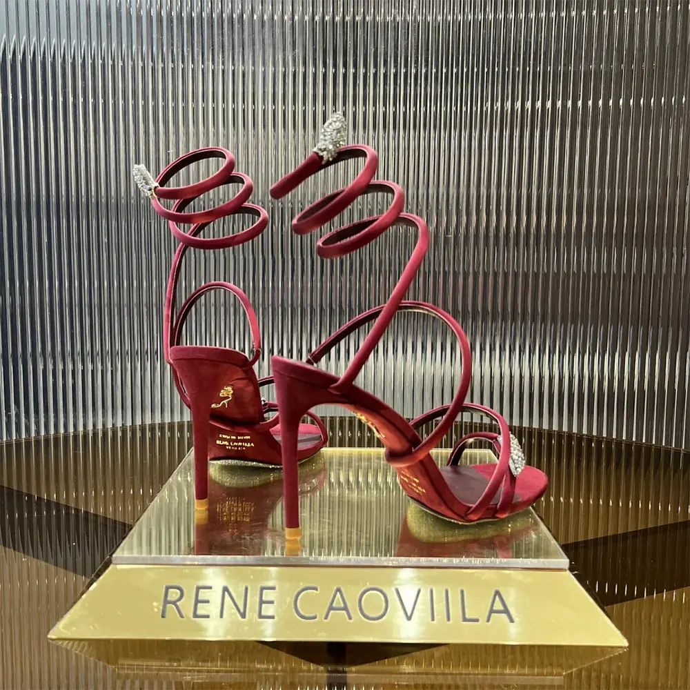 Back view showing ankle strap on Rene Caovilla Serpente Midnight Red Sandal