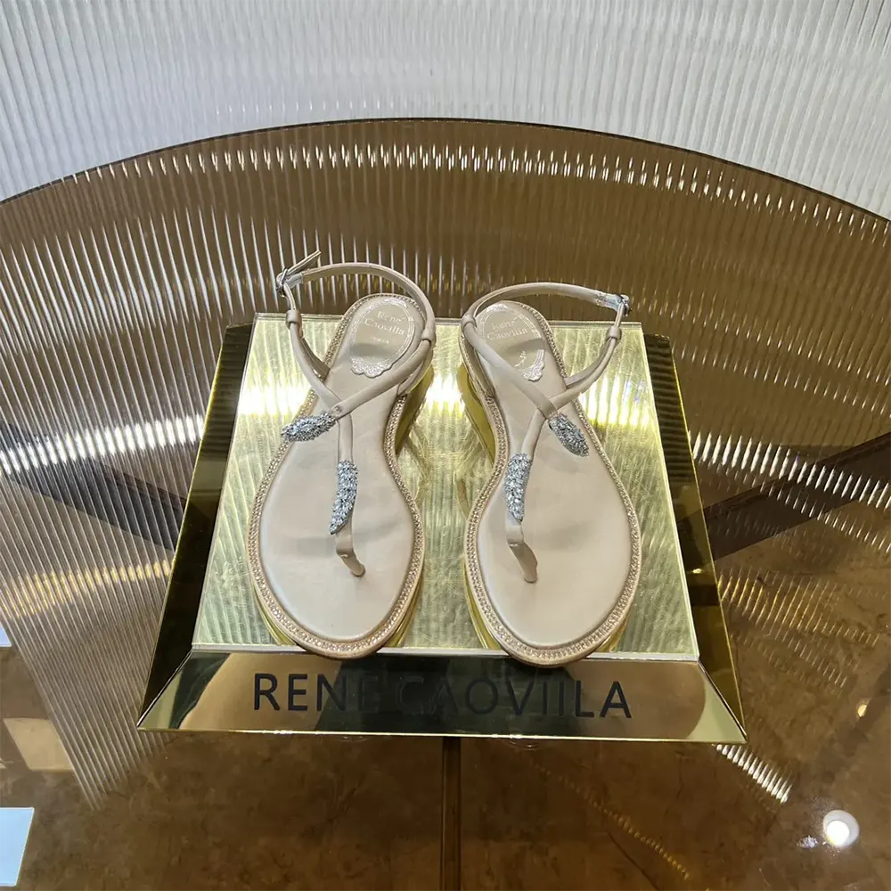 Close-up of crystal-embellished serpent on Rene Caovilla Women Serpente Nude Thong Sandal 10