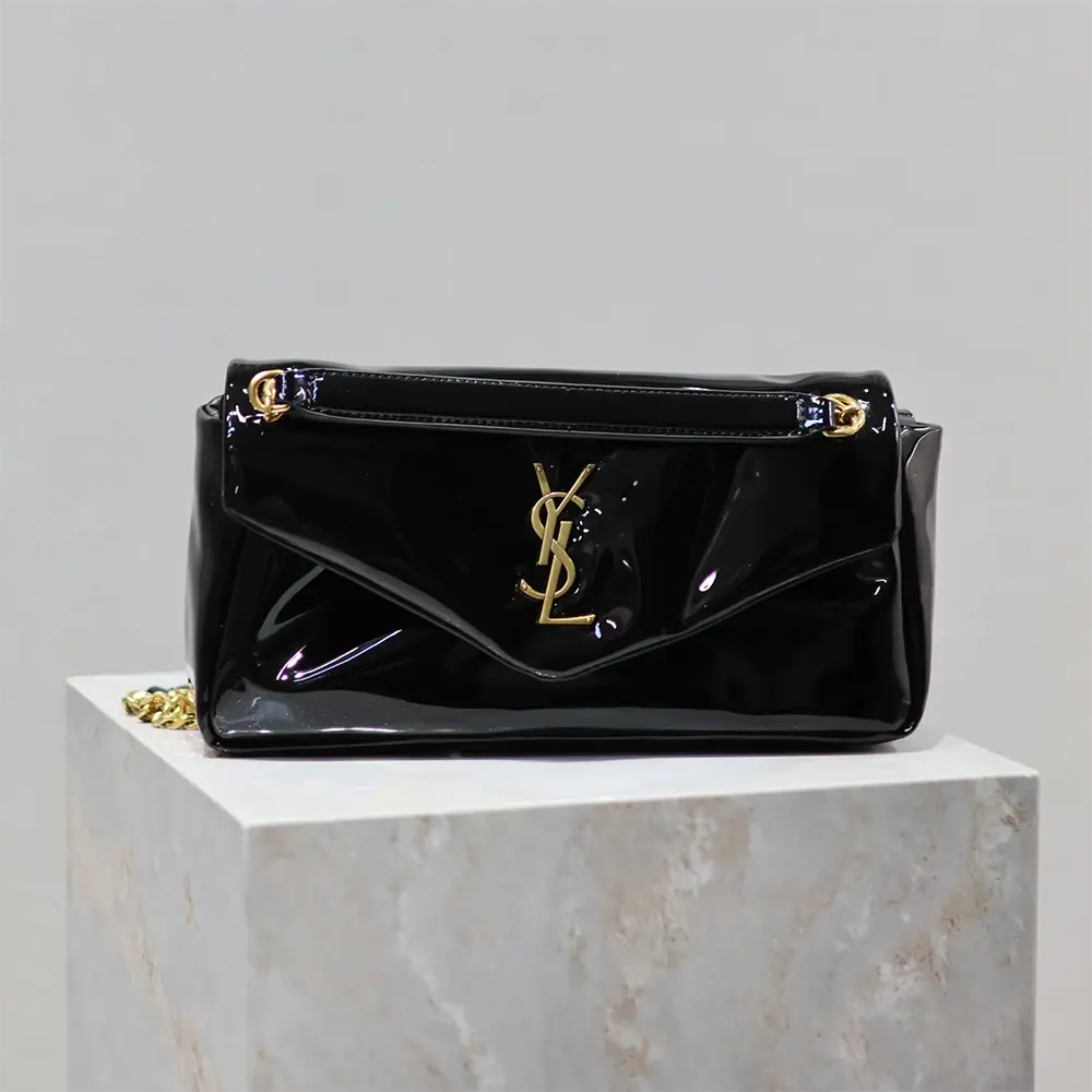 Close-up of gold YSL logo hardware on Saint Laurent YSL Women Calypso Small
