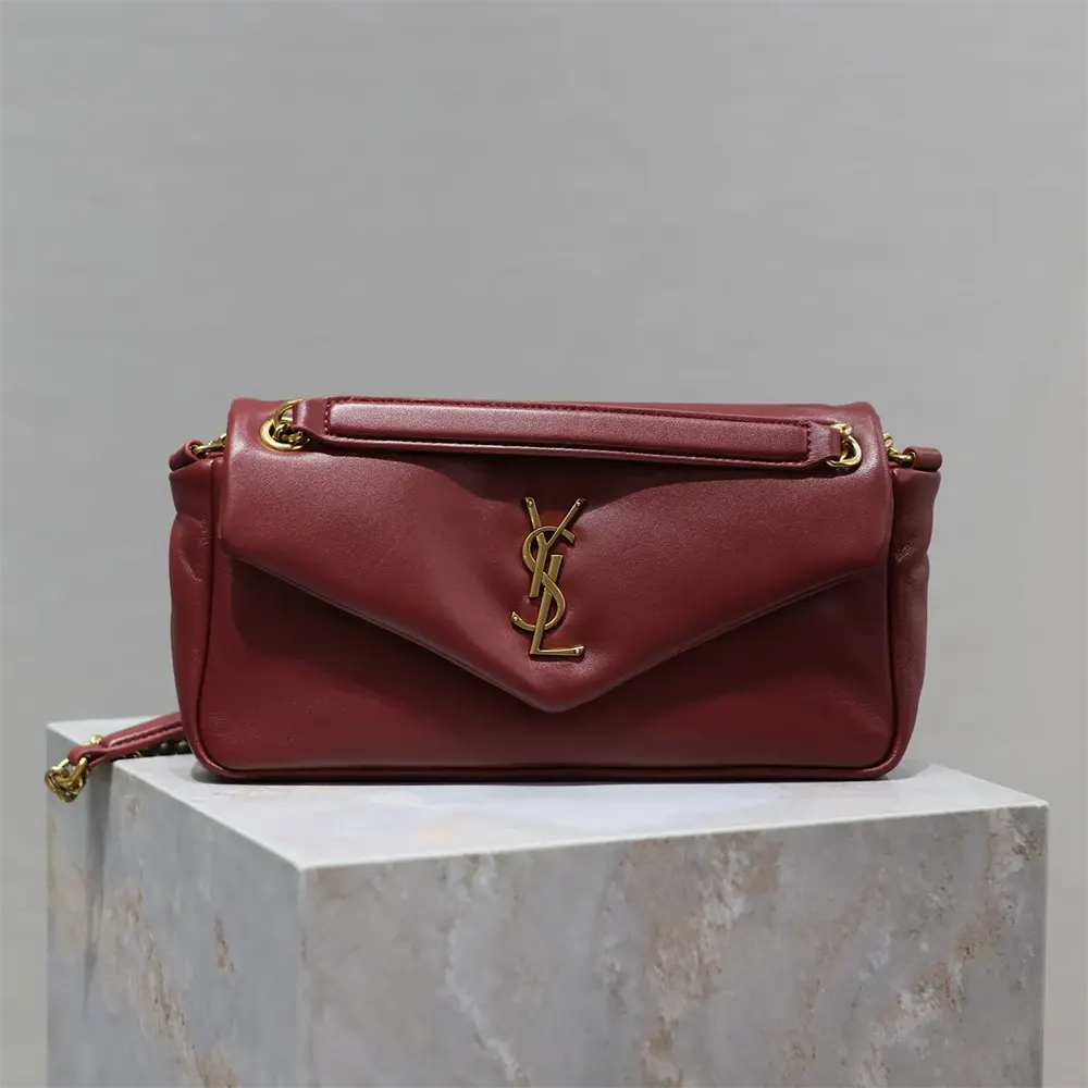 Close-up of gold-tone YSL logo hardware on Saint Laurent YSL Women Calypso Small