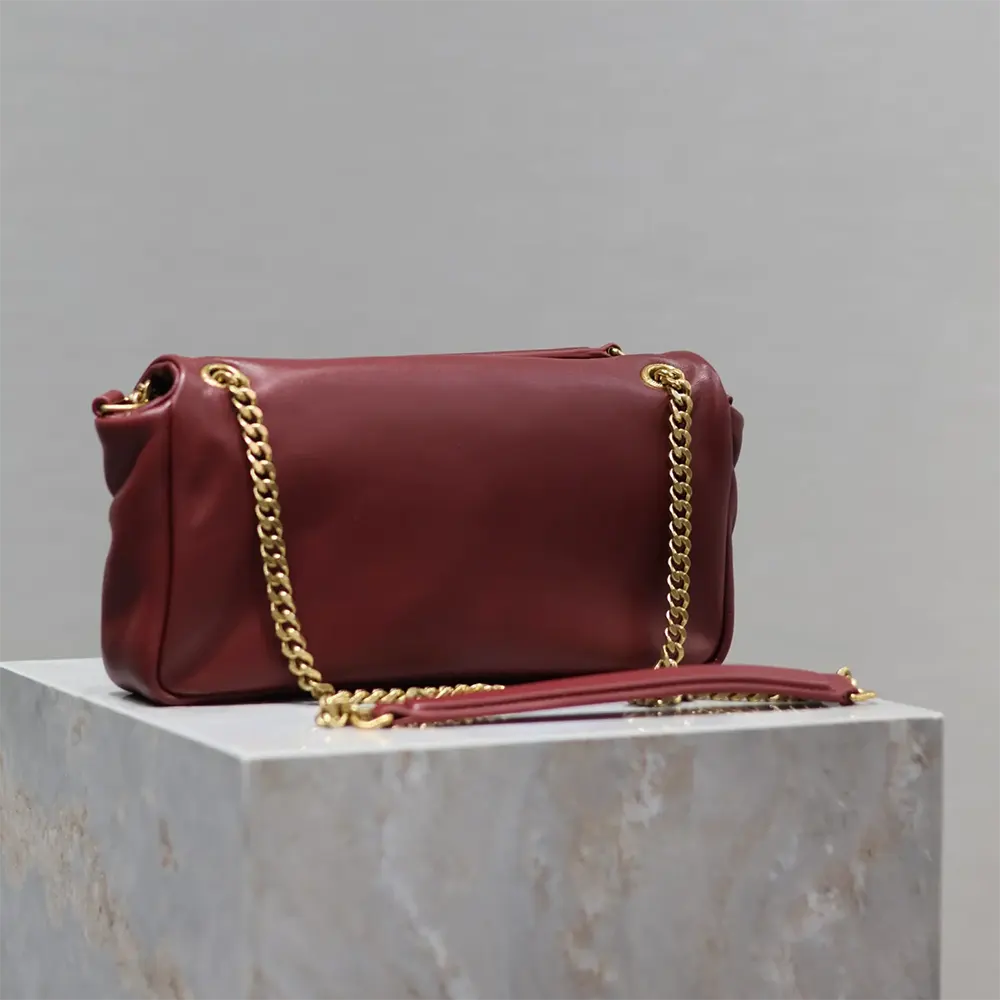 Side angle showing adjustable strap of Saint Laurent YSL Women Calypso Small bag