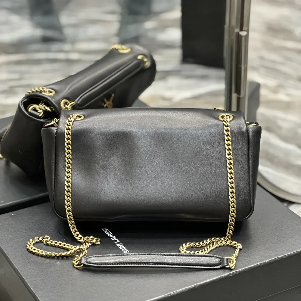Side angle showing texture and silhouette of Saint Laurent YSL Calypso bag
