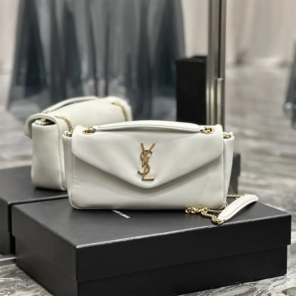 Close-up of gold YSL clasp on Calypso lambskin shoulder bag