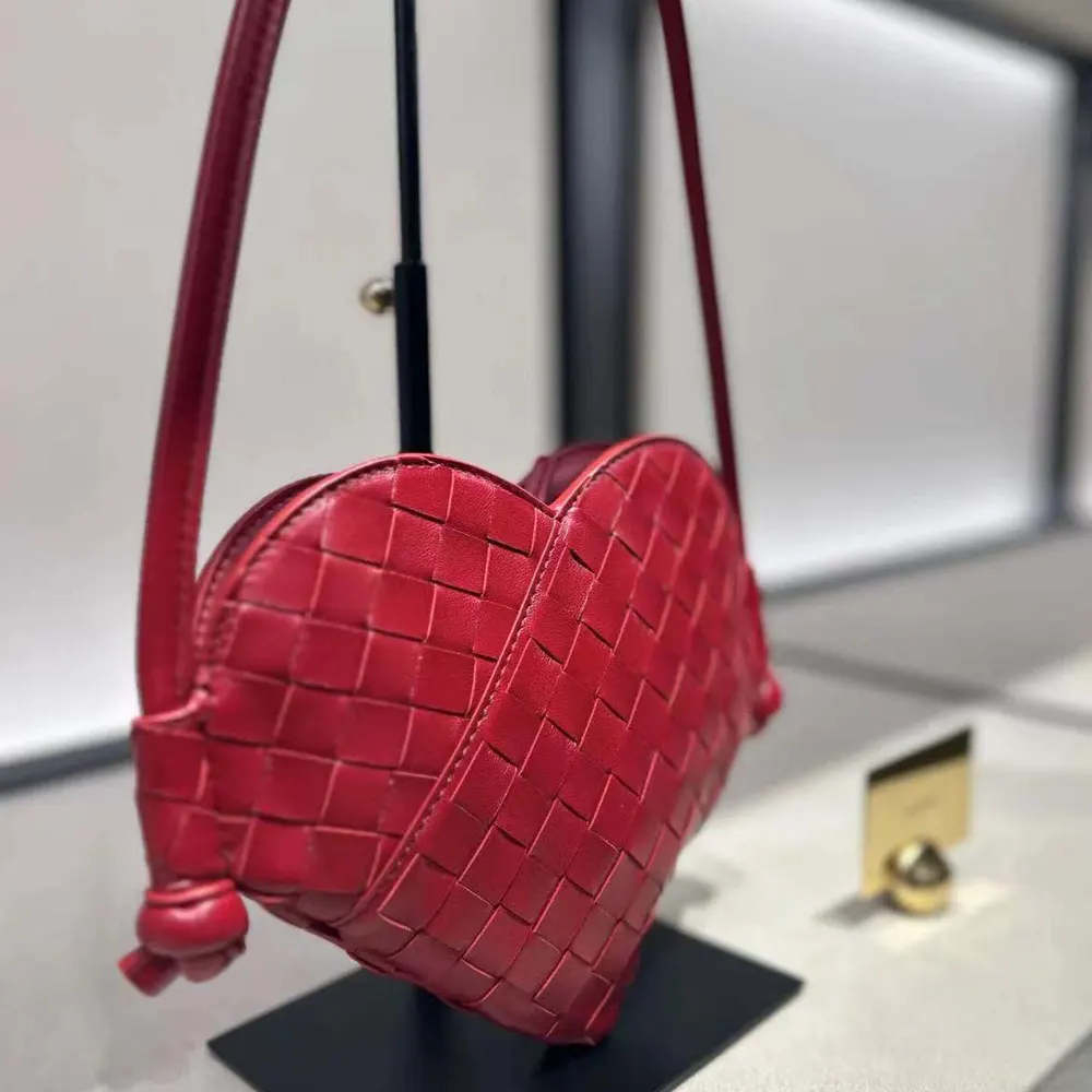 Side angle showing gold-tone hardware on Bottega Veneta Mini Solstice Heart-shaped bag