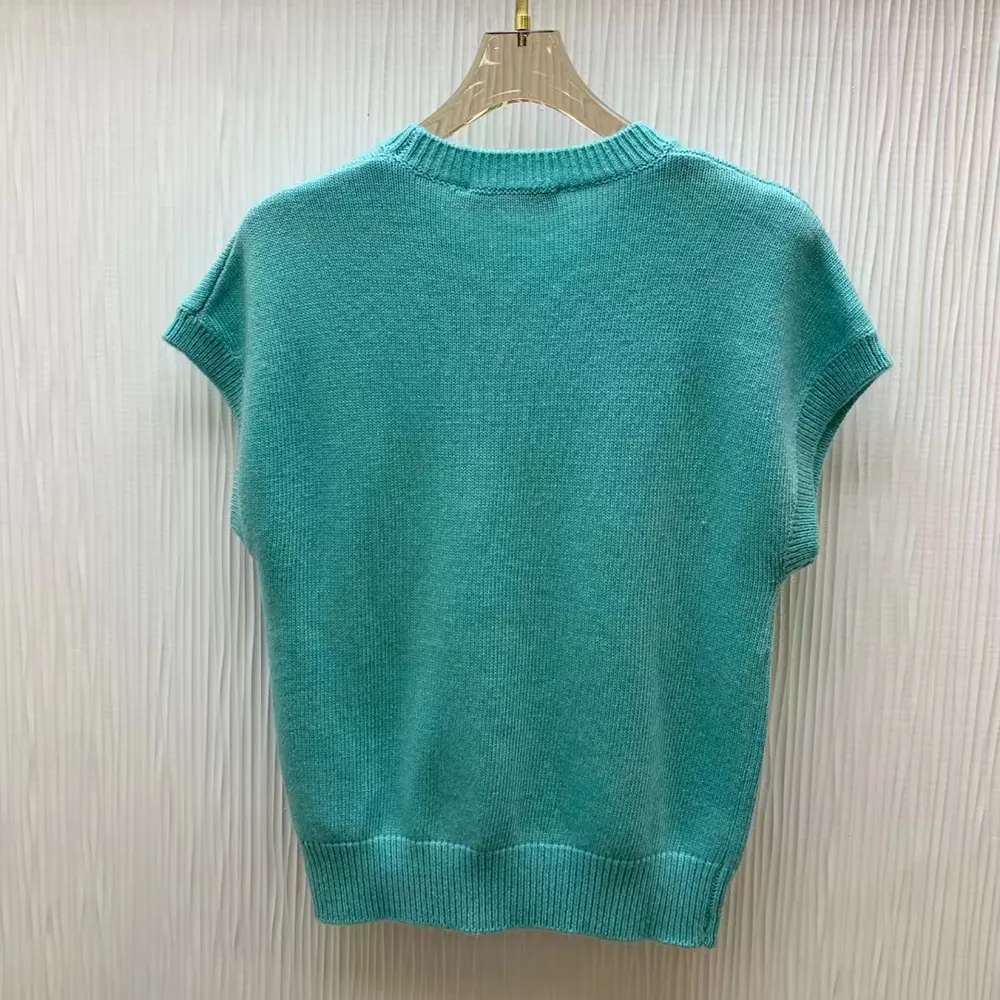 Side angle showing relaxed fit of Dior Women Dioriviera Short-Sleeved Sweater