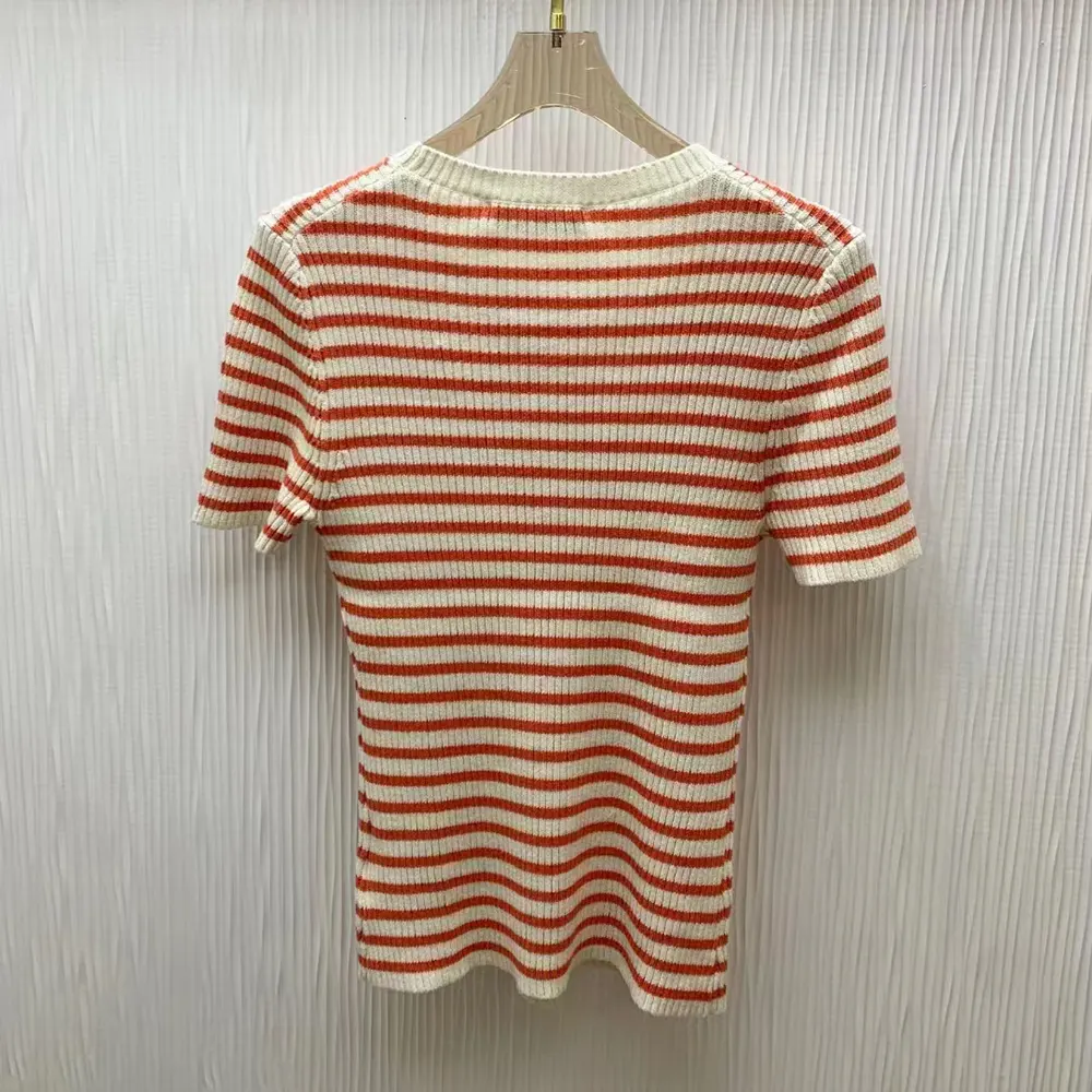Side angle showcasing silhouette and short sleeves of Dioriviera sweater