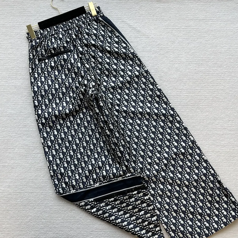 Side angle of Dior Women Flared Pants highlighting flared silhouette and zipper