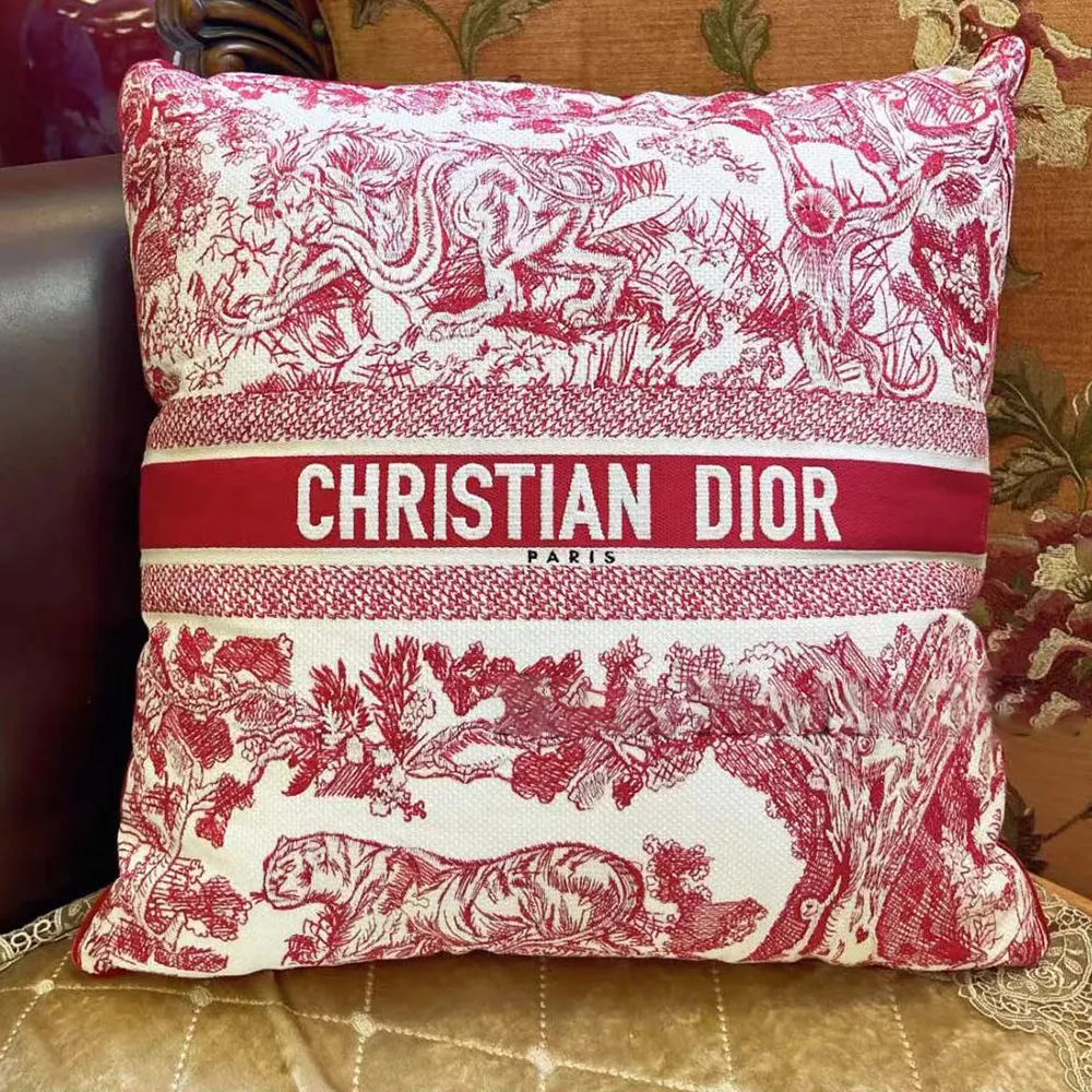 Close-up on signature Dior stitching of Square Pillow Toile de Jouy Burgundy