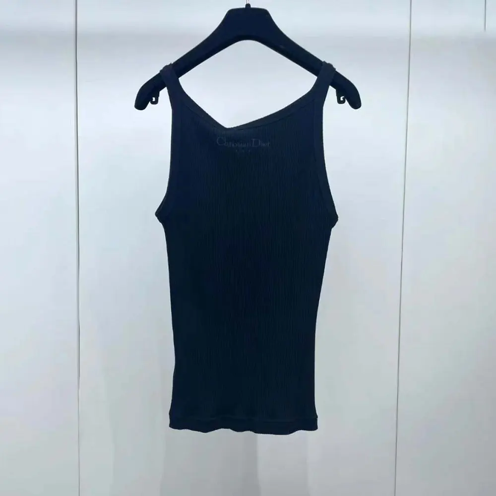 Side profile showing slim fit of Dior Women Tank Top Black Ribbed Cotton Jersey