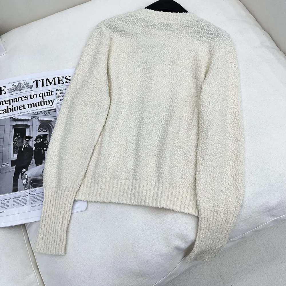 Side profile showing fitted silhouette of Dior Women Twinset knitwear